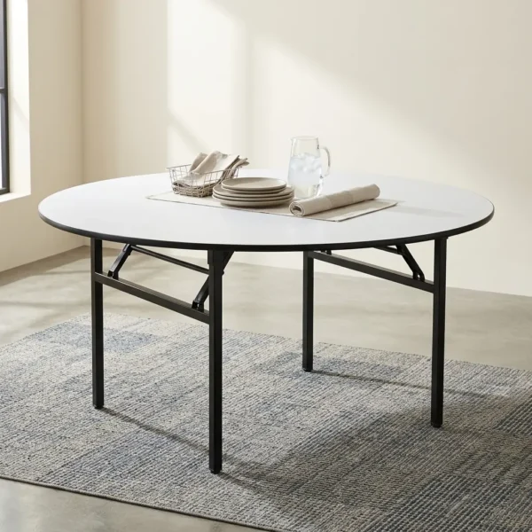 White 1.5m Round Office Meeting Table with black folding metal legs surrounded by blue upholstered chairs on a grey rug.